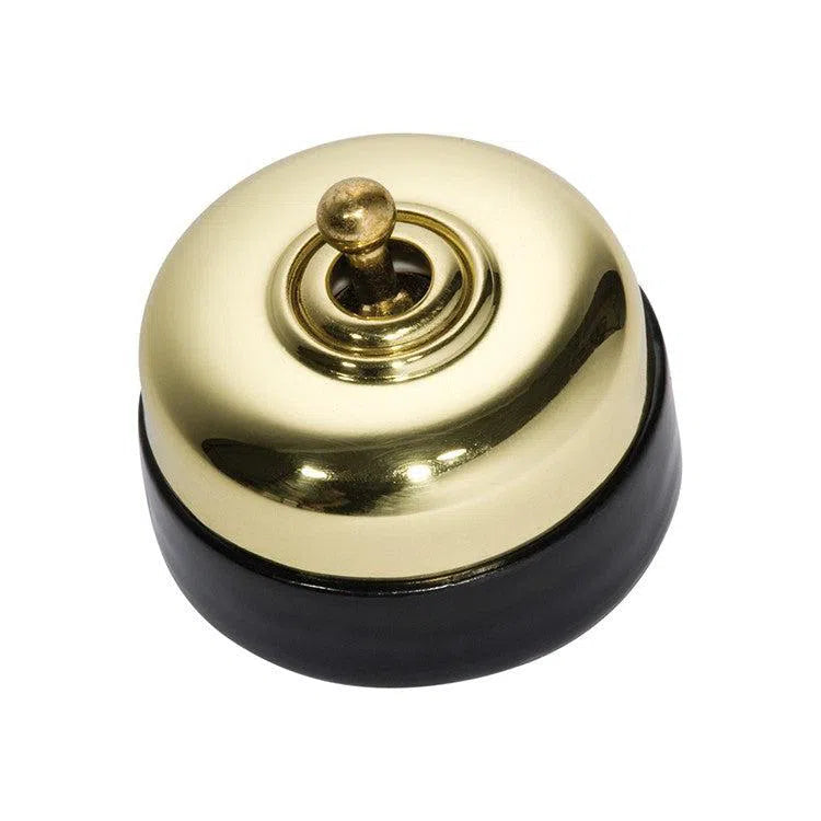 Tradco Switch Black Porcelain Base Polished Brass